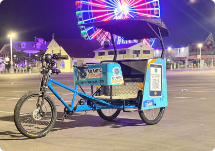 Atlantic Pedicabs pedicab at night